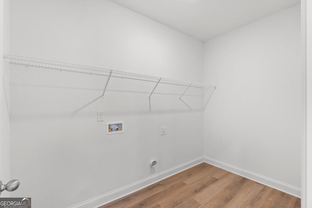 59 Oak Road Locust Grove, GA 30248 - Photo 11 of 38 a view of a room with racks on the wall