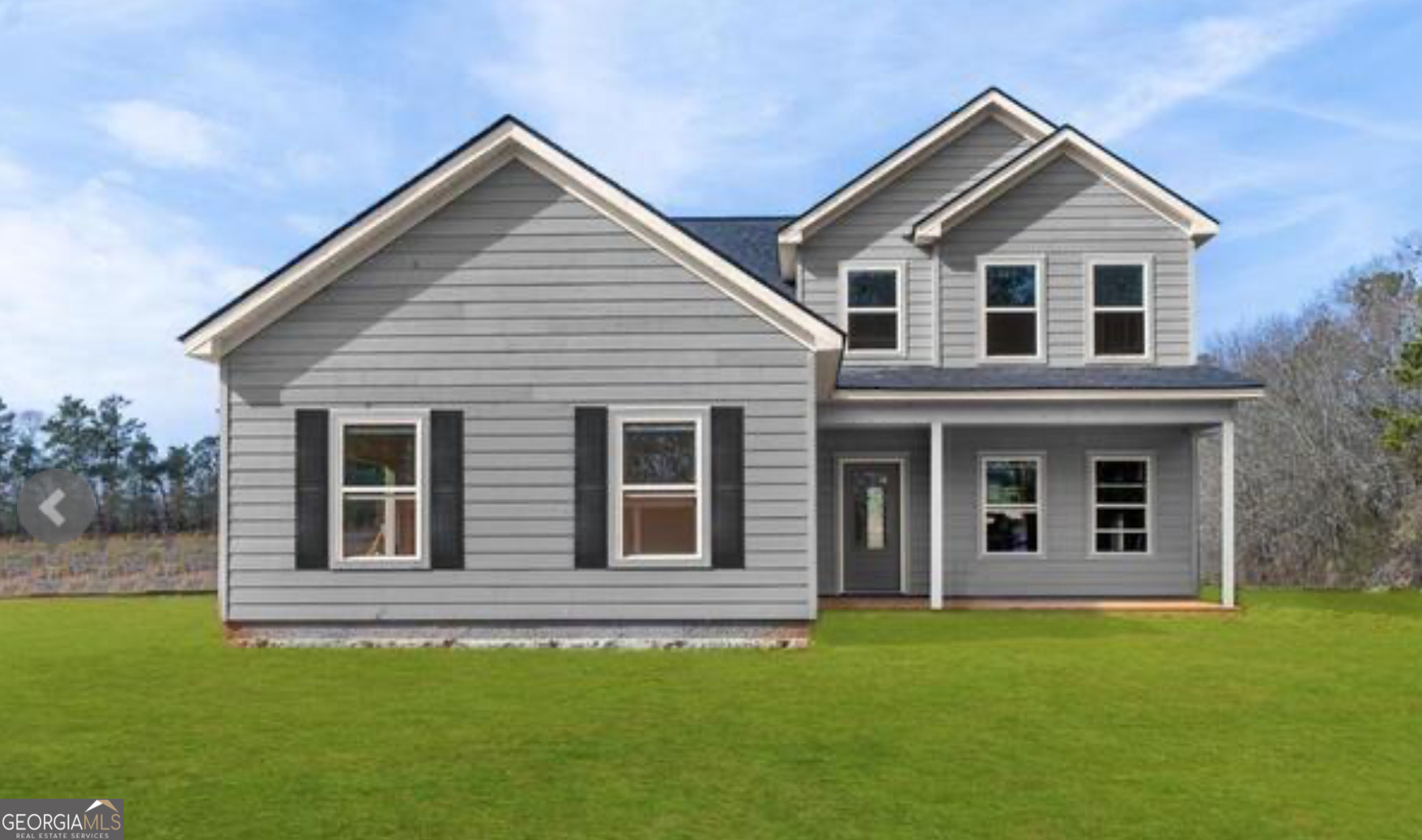 59 Oak Road Locust Grove, GA 30248 - Photo 12 of 13 a front view of a house with a garden