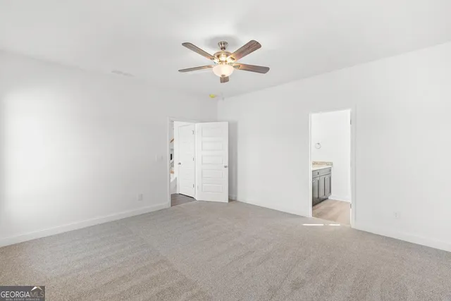 a view of a livingroom with a ceiling fan