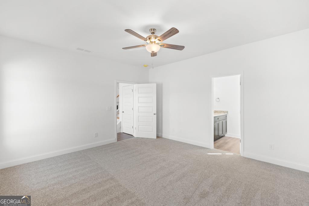 59 Oak Road Locust Grove, GA 30248 - Photo 21 of 38 a view of a livingroom with a ceiling fan