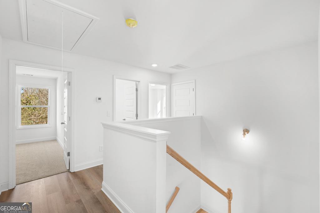 59 Oak Road Locust Grove, GA 30248 - Photo 25 of 38 a view of an empty room with wooden floor and a window