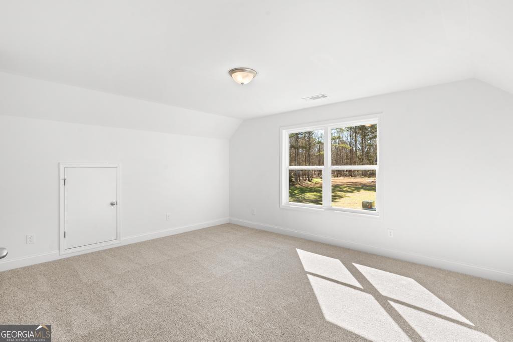 59 Oak Road Locust Grove, GA 30248 - Photo 26 of 38 a view of an empty room with a window