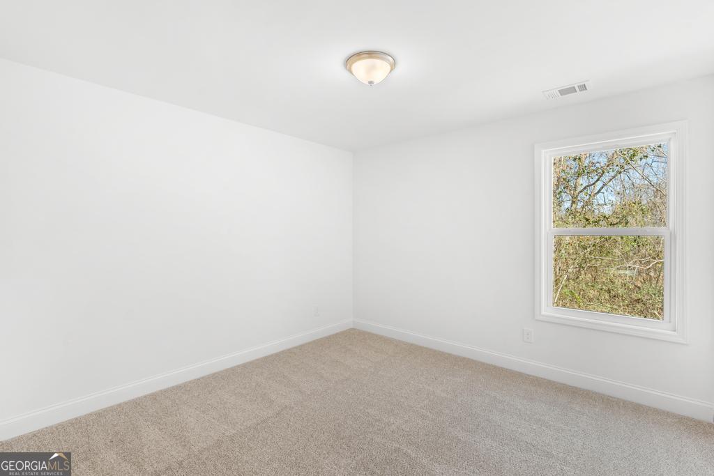 59 Oak Road Locust Grove, GA 30248 - Photo 28 of 38 an empty room with a window