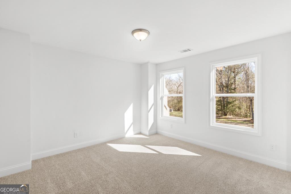 59 Oak Road Locust Grove, GA 30248 - Photo 32 of 38 an empty room with windows