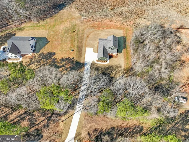 a aerial view of a house with a yard