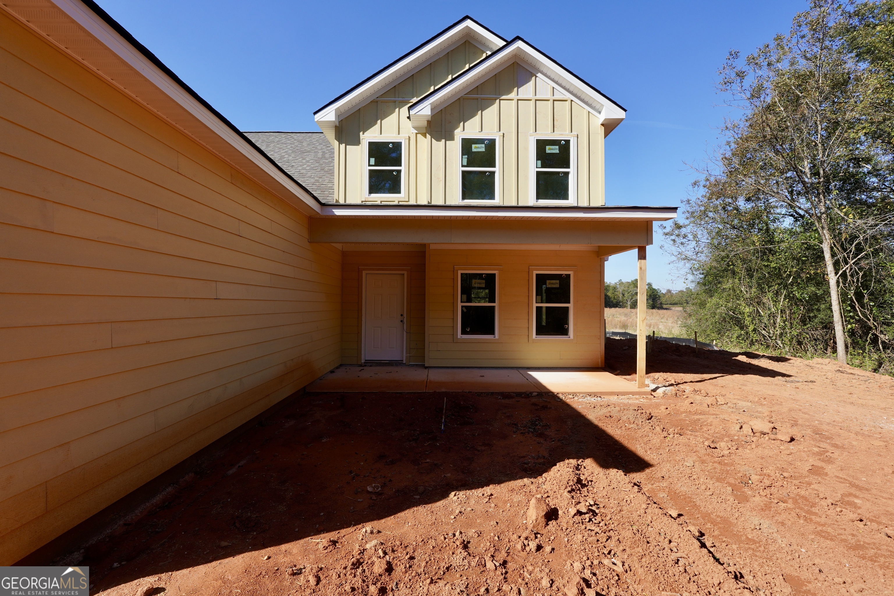 59 Oak Road Locust Grove, GA 30248 - Photo 4 of 13 a front view of a house with a yard