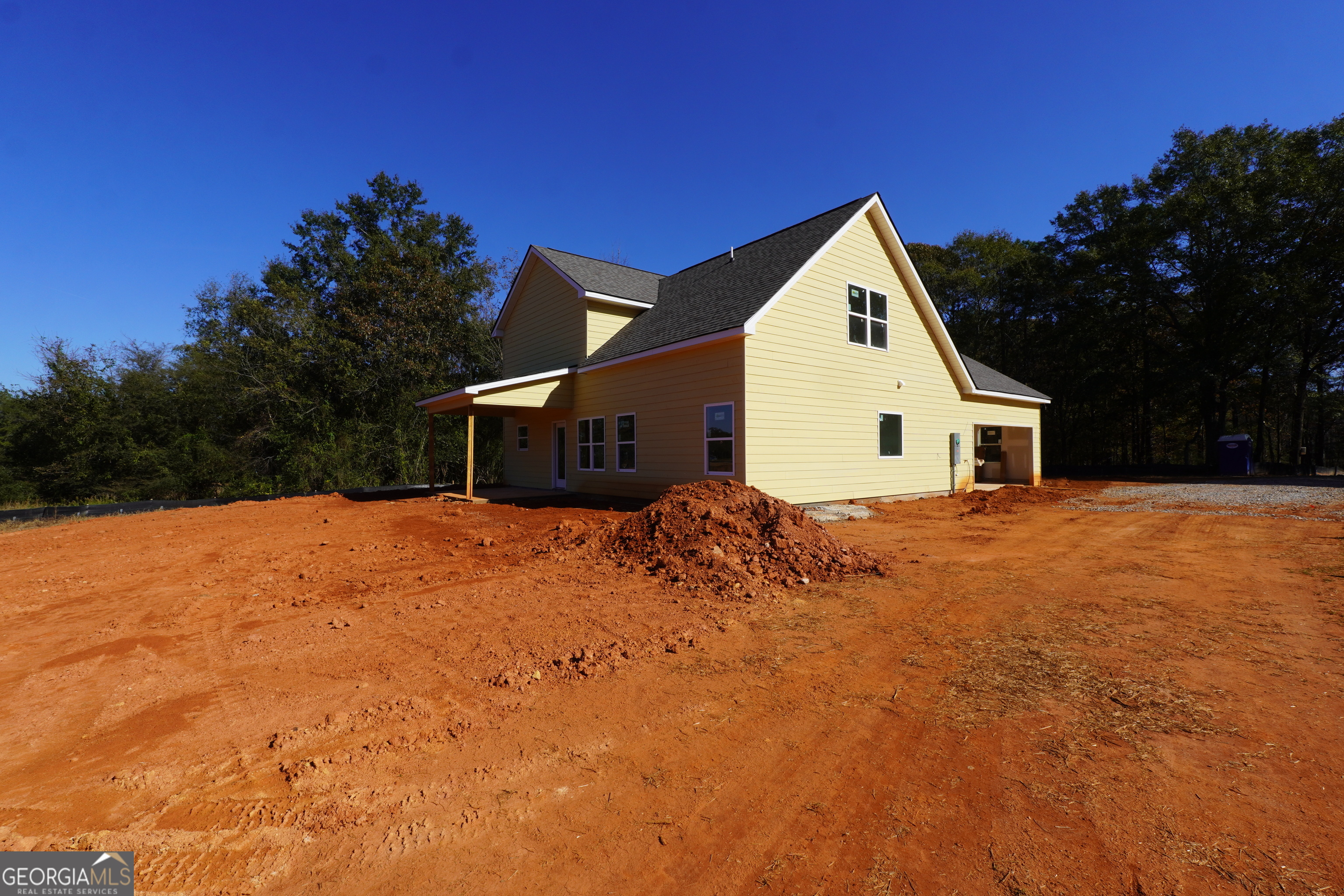59 Oak Road Locust Grove, GA 30248 - Photo 5 of 13 a view of a house with a yard
