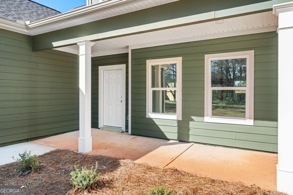 59 Oak Road Locust Grove, GA 30248 - Photo 6 of 38 a house with a outdoor space
