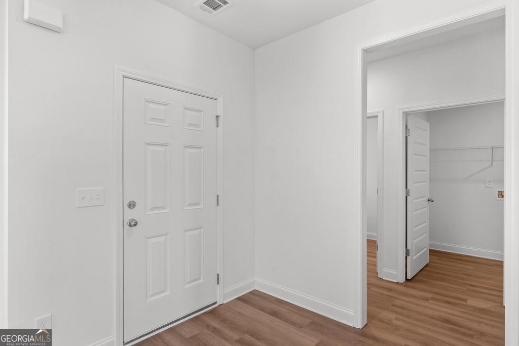 59 Oak Road Locust Grove, GA 30248 - Photo 8 of 38 an empty room with wooden floor & closet area