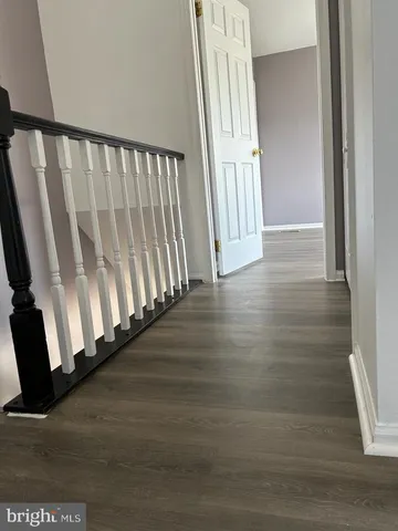 a view of a porch with wooden floor