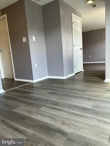 a view of a livingroom with wooden floor