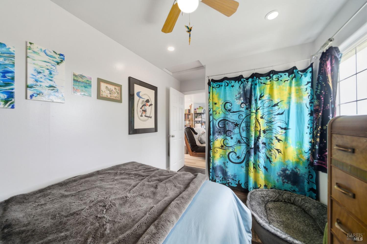 3960 Llano Road Santa Rosa, CA 95407 - Photo 24 of 52 a bedroom with bed and sliding glass door