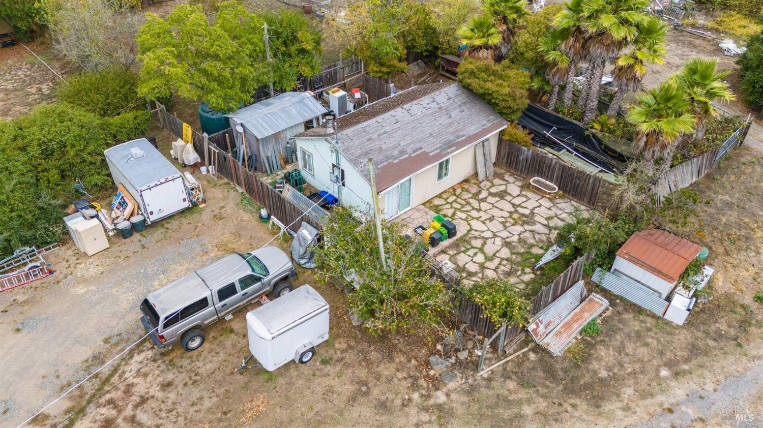 3960 Llano Road Santa Rosa, CA 95407 - Photo 48 of 52 an aerial view of a house with a yard and trees