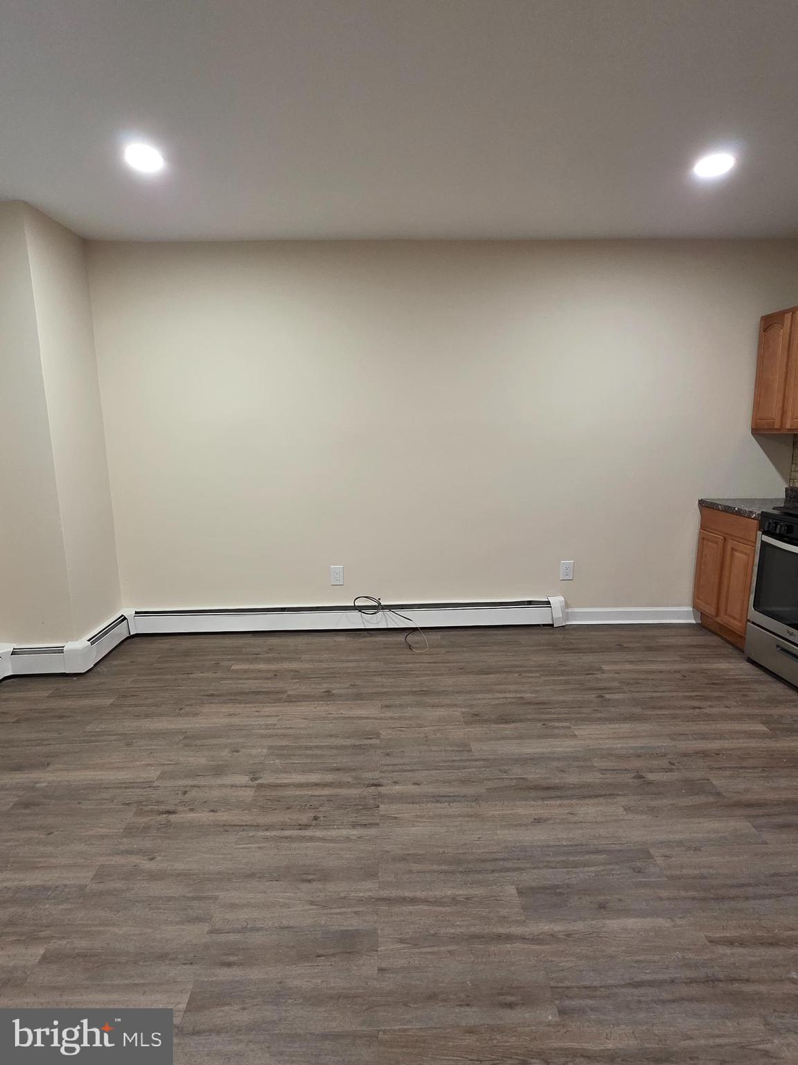 2715 East Ontario Street, Unit C Philadelphia, PA 19134 - Photo 11 of 32 an empty room with wooden floor and natural light