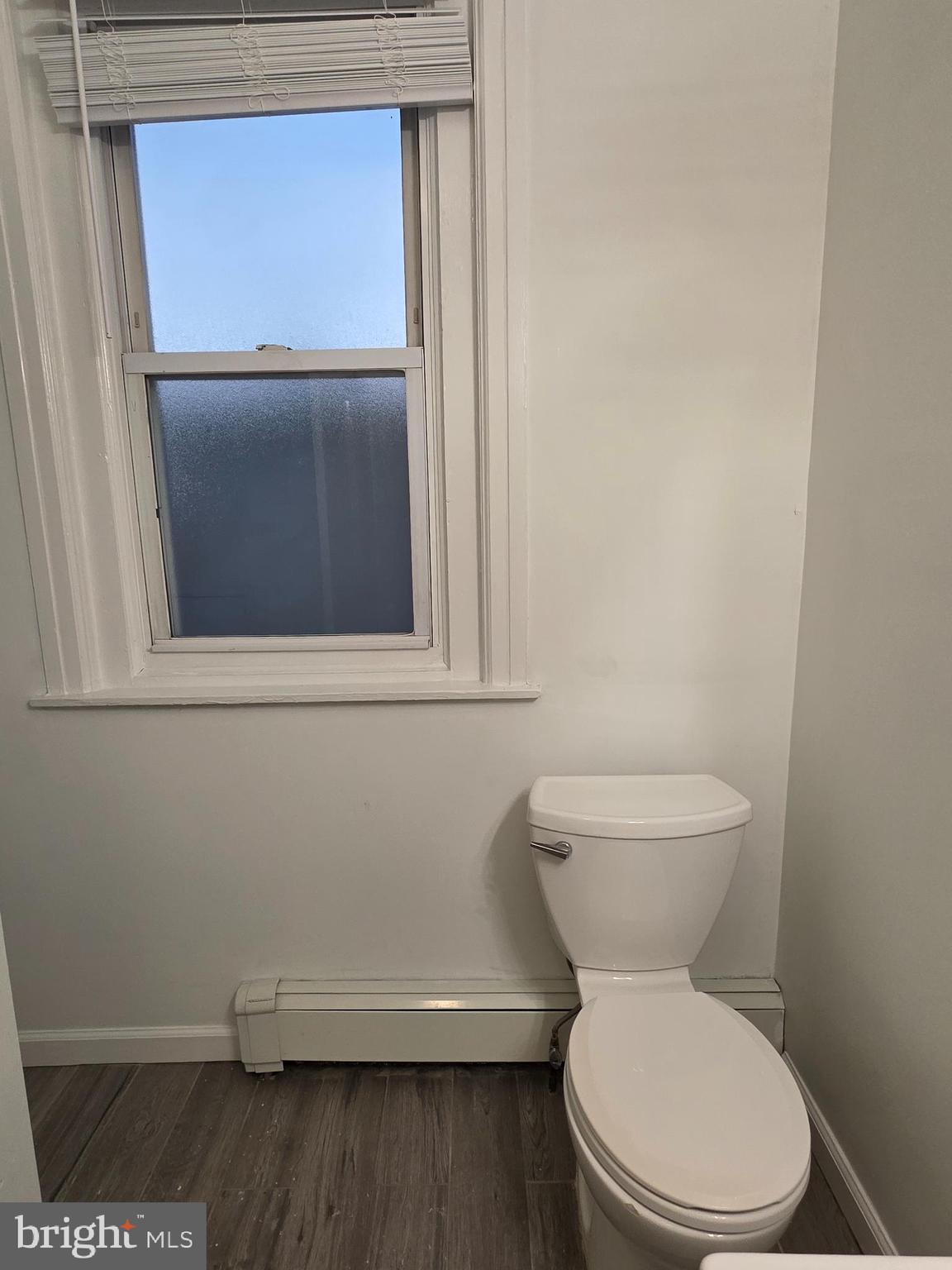 2715 East Ontario Street, Unit C Philadelphia, PA 19134 - Photo 18 of 32 a white toilet sitting next to a sink