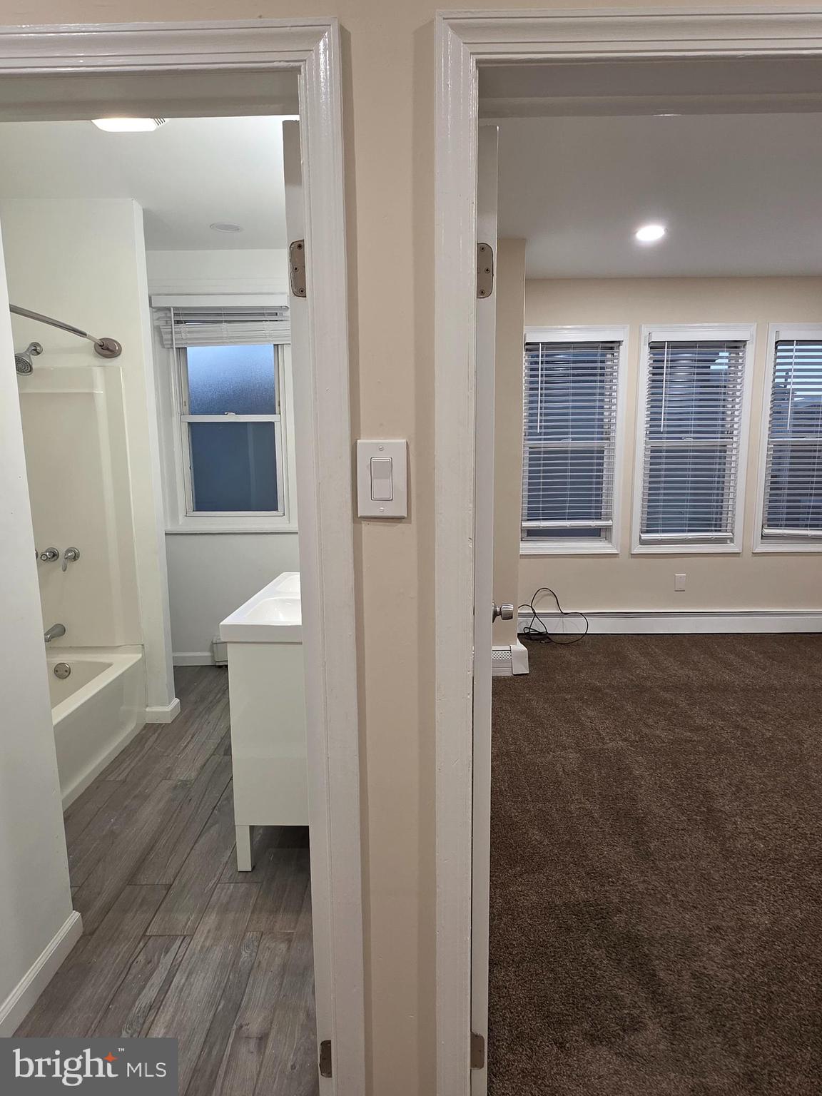 2715 East Ontario Street, Unit C Philadelphia, PA 19134 - Photo 7 of 32 wooden floor in an empty room and a window