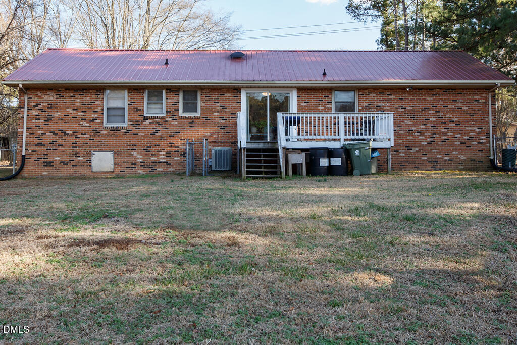 1727 Pinecrest Road Henderson, NC 27536 - Photo 2 of 14 a view of a house with a yard