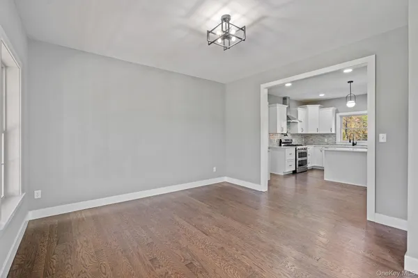 a view of an entryway with wooden floor