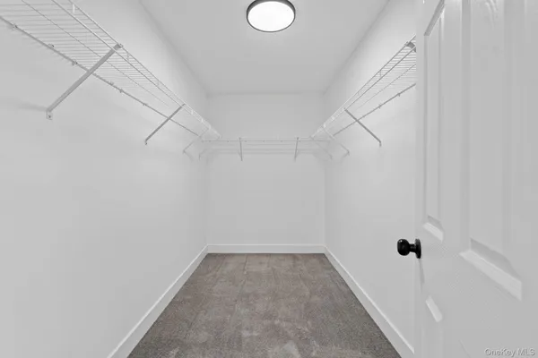a spacious bathroom with a shower sink vanity and mirror