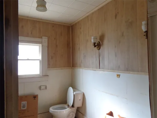 a bathroom with a toilet sink
