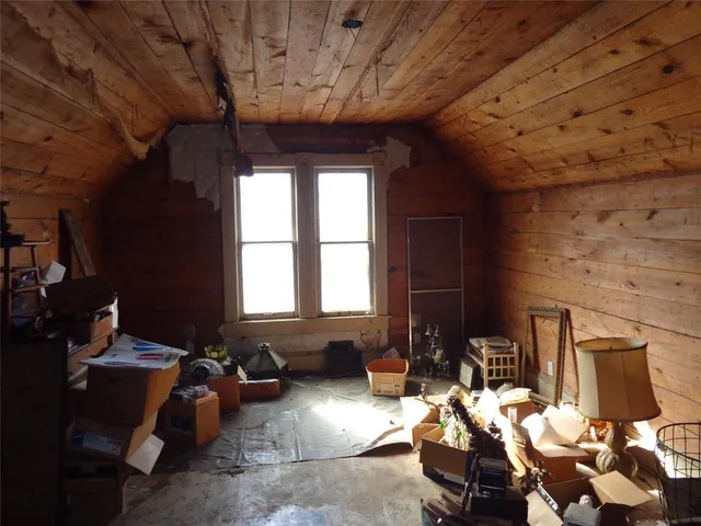 a living room filled with furniture and a fireplace