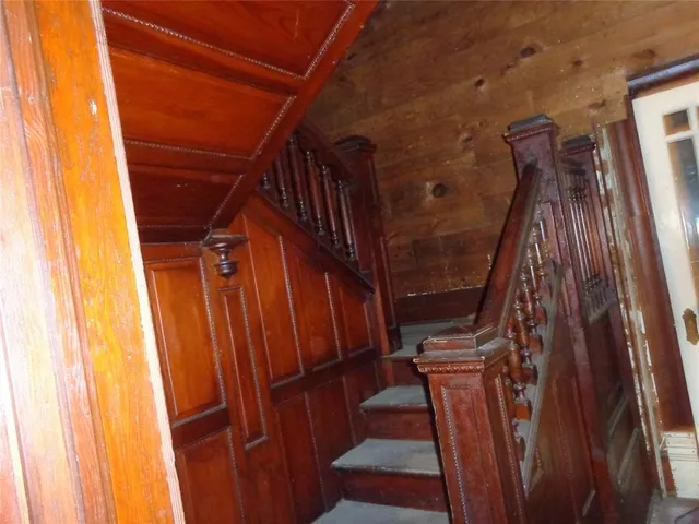 a view of a yard with a house in the background