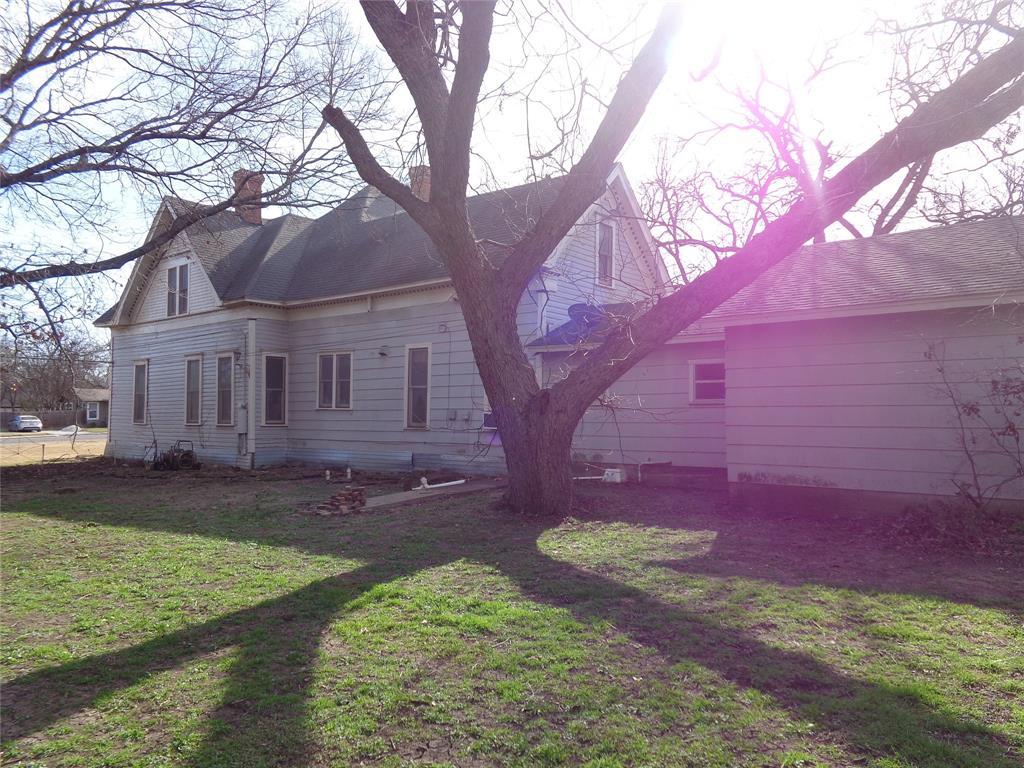 506 South 3rd Street Grandview, TX 76050 - Photo 28 of 39 a view of a yard with a house in the background