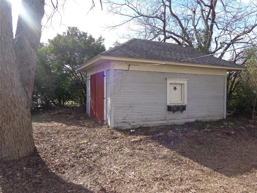 506 South 3rd Street Grandview, TX 76050 - Photo 33 of 39 a view of a house with a yard and tree