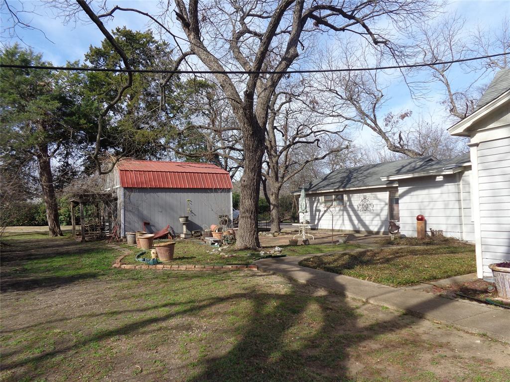 506 South 3rd Street Grandview, TX 76050 - Photo 35 of 39 a view of a house with backyard porch and sitting area