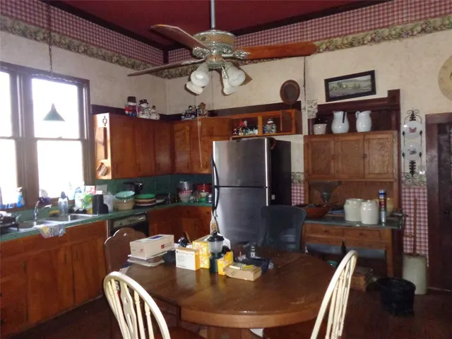 a dining room with furniture and a chandelier