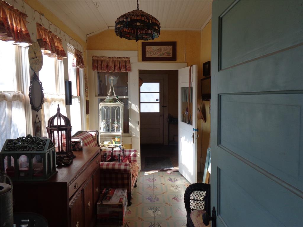 506 South 3rd Street Grandview, TX 76050 - Photo 8 of 39 a dining room with furniture and chandelier