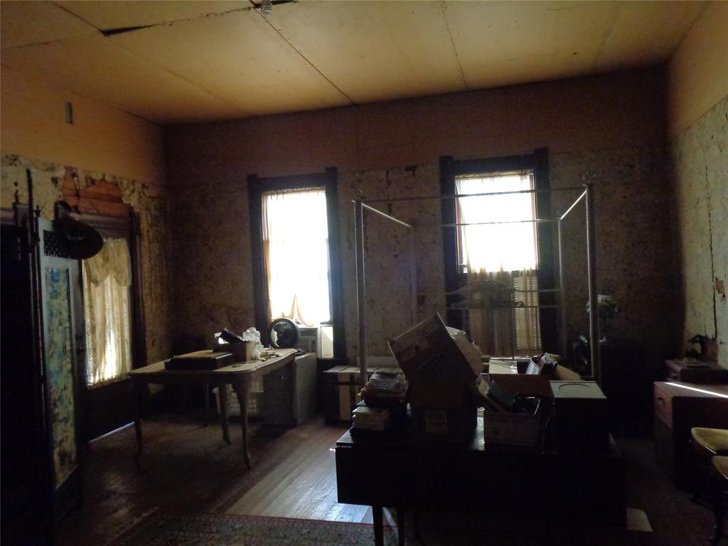 506 South 3rd Street Grandview, TX 76050 - Photo 10 of 39 a living room with furniture and a large window