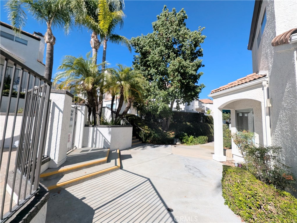 13133 Le Parc, Unit 1009 Chino Hills, CA 91709 - Photo 1 of 21 a view of a house with backyard and sitting area