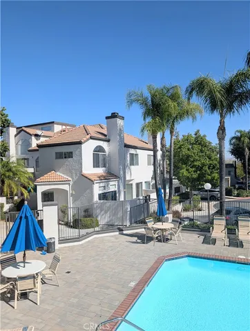 a view of a patio with swimming pool