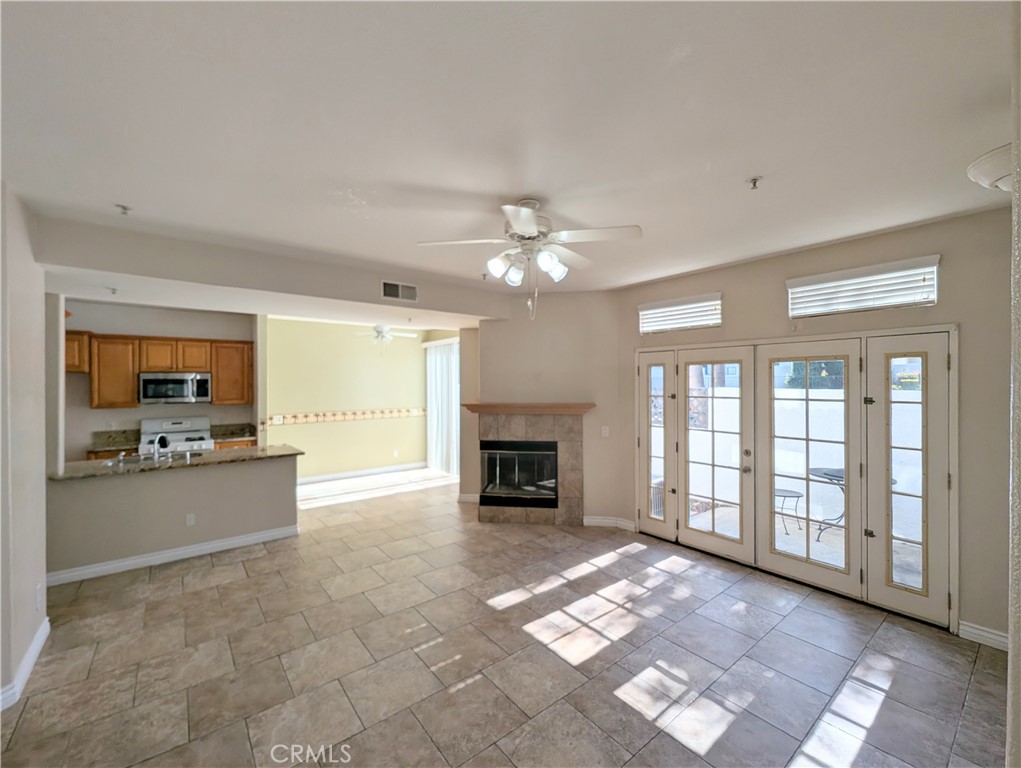 13133 Le Parc, Unit 1009 Chino Hills, CA 91709 - Photo 5 of 21 a large hall with a fireplace and window
