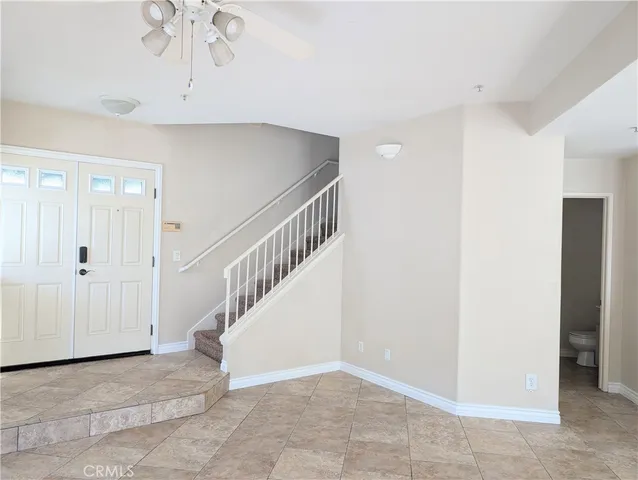 a view of entryway and hall with a chandelier