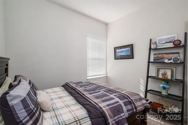 a bathroom with a sink vanity mirror and toilet