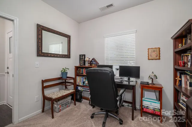 a view of a workspace with bookshelf