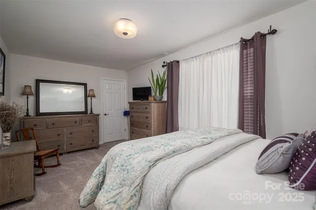 a bathroom with a sink mirror vanity and toilet