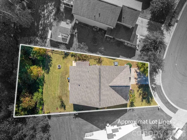 a view of a back yard of the house and a chair