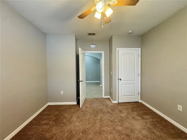 an empty room with a bathroom