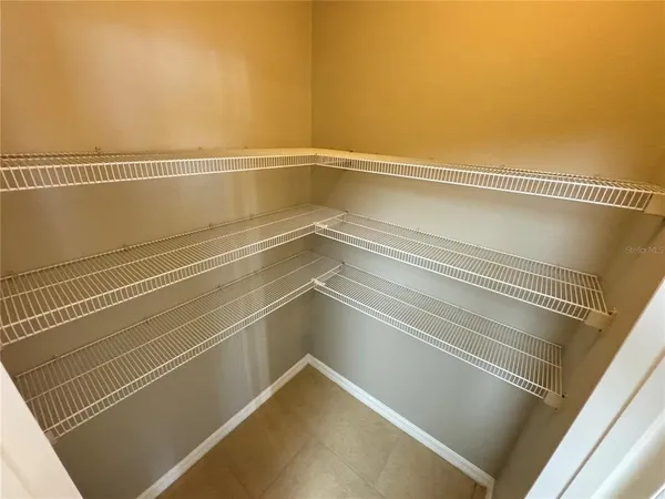 a view of a room with racks on the wall