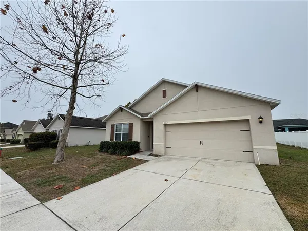 a view of garage and yard
