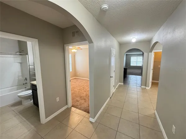a bathroom with a glass door shower