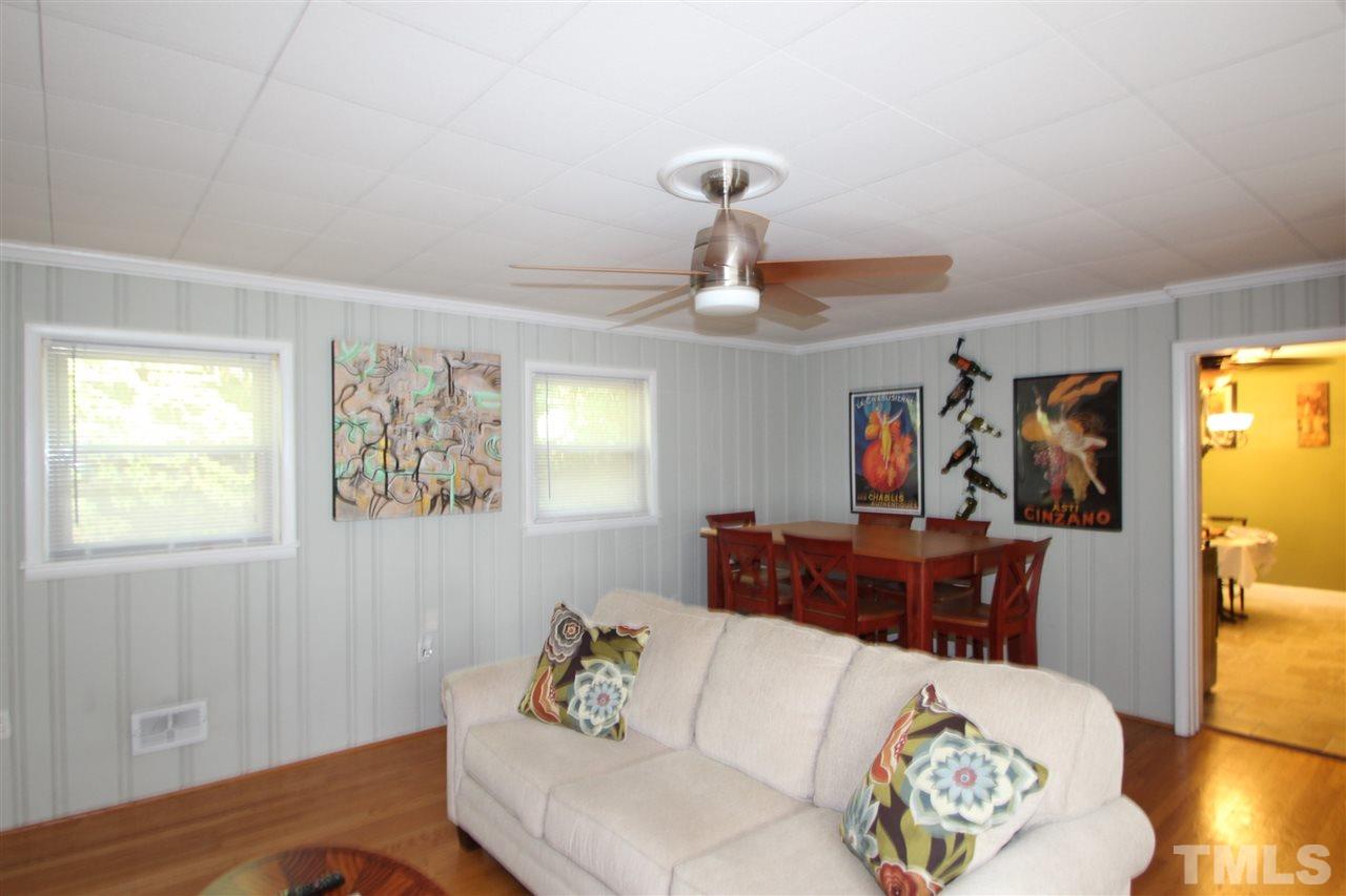 2042 Wake Forest Road Raleigh, NC 27608 - Photo 4 of 17 Large family room with fireplace and built-in bookshelves