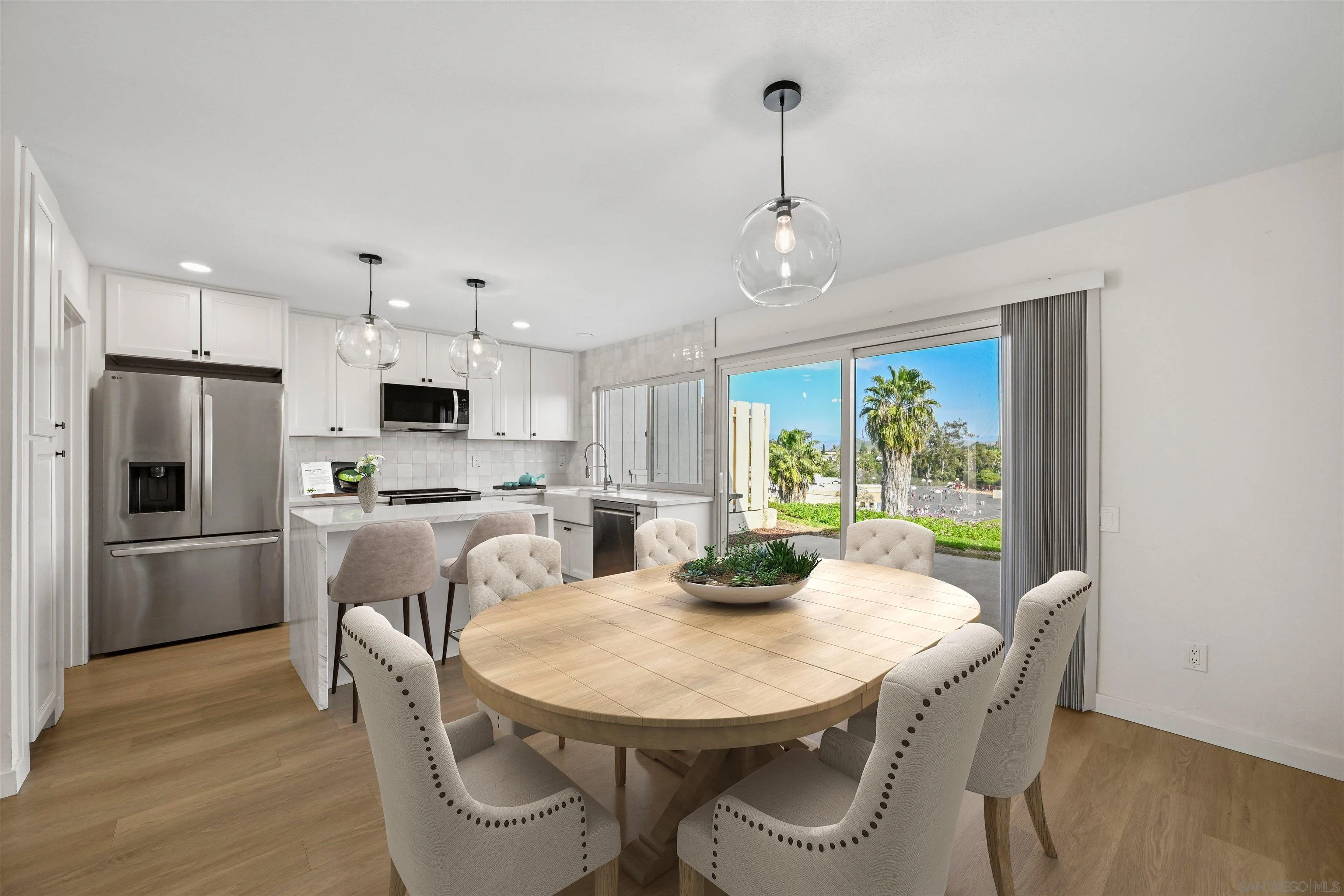 11218 Poblado Road San Diego, CA 92127 - Photo 12 of 35 a view of a dining room with furniture window and wooden floor