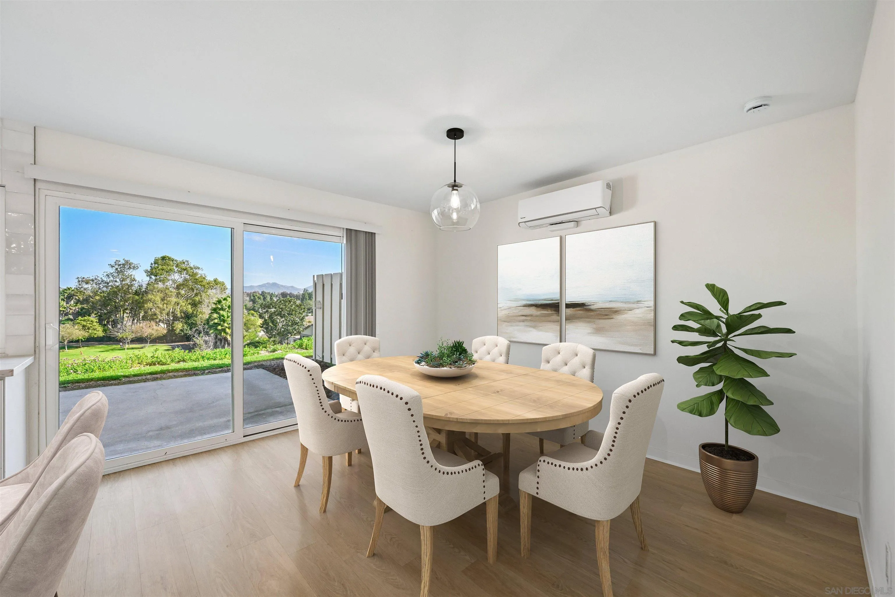 11218 Poblado Road San Diego, CA 92127 - Photo 14 of 35 a view of a dining room with furniture window and wooden floor