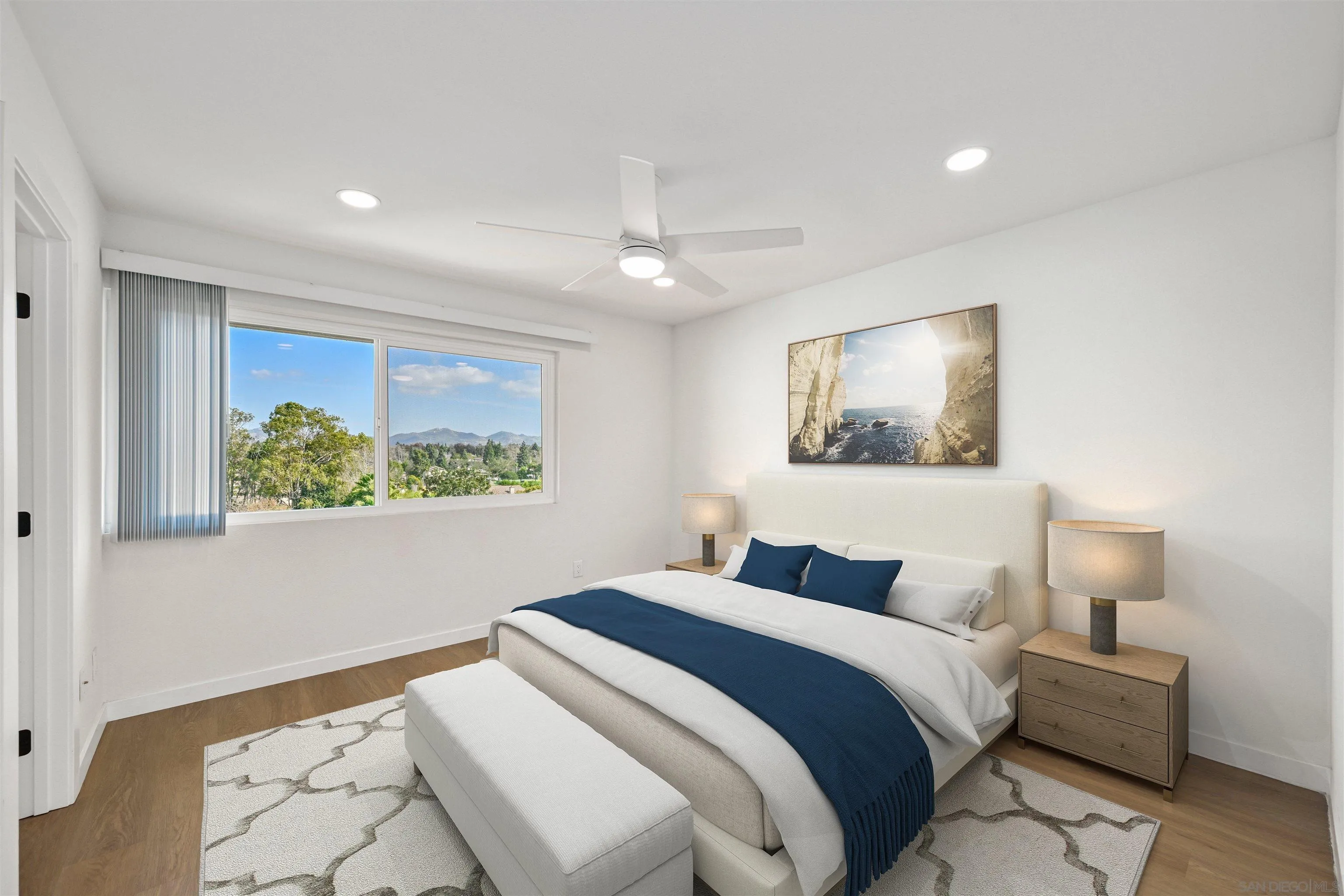 11218 Poblado Road San Diego, CA 92127 - Photo 17 of 35 a bedroom with a bed and a painting on the wall