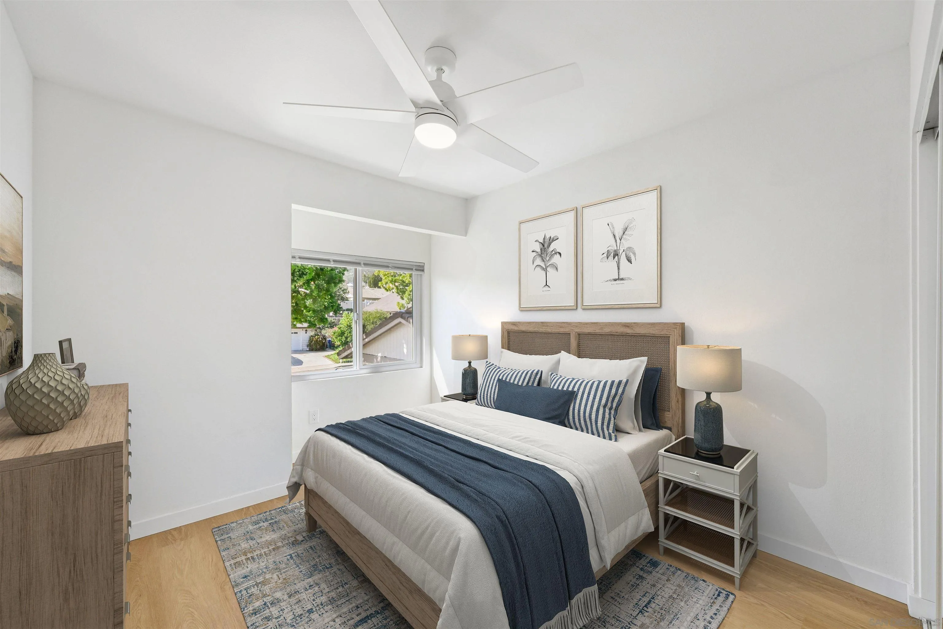 11218 Poblado Road San Diego, CA 92127 - Photo 21 of 35 a bedroom with a bed and a window