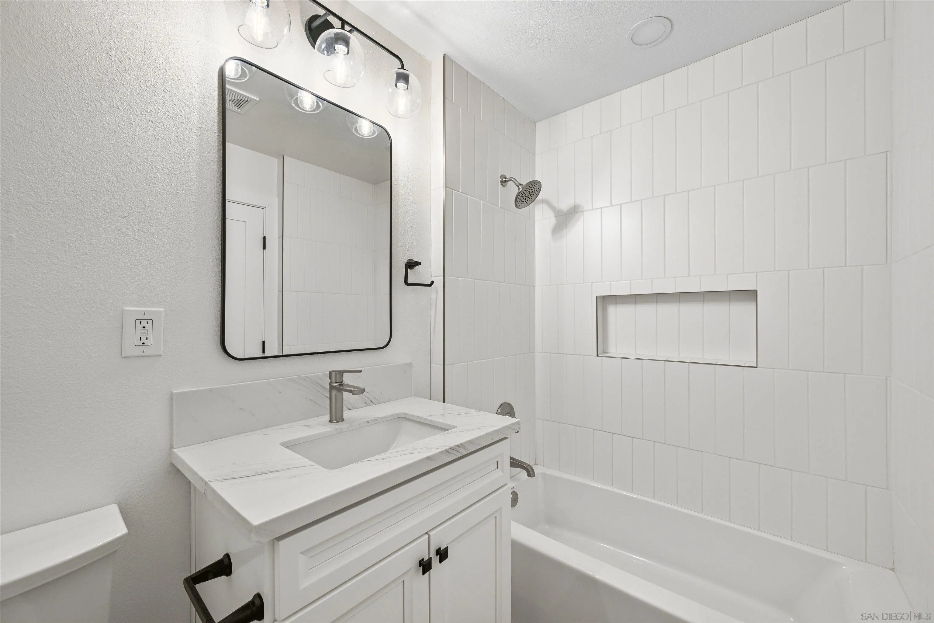 11218 Poblado Road San Diego, CA 92127 - Photo 23 of 35 a bathroom with a sink a vanity and a mirror